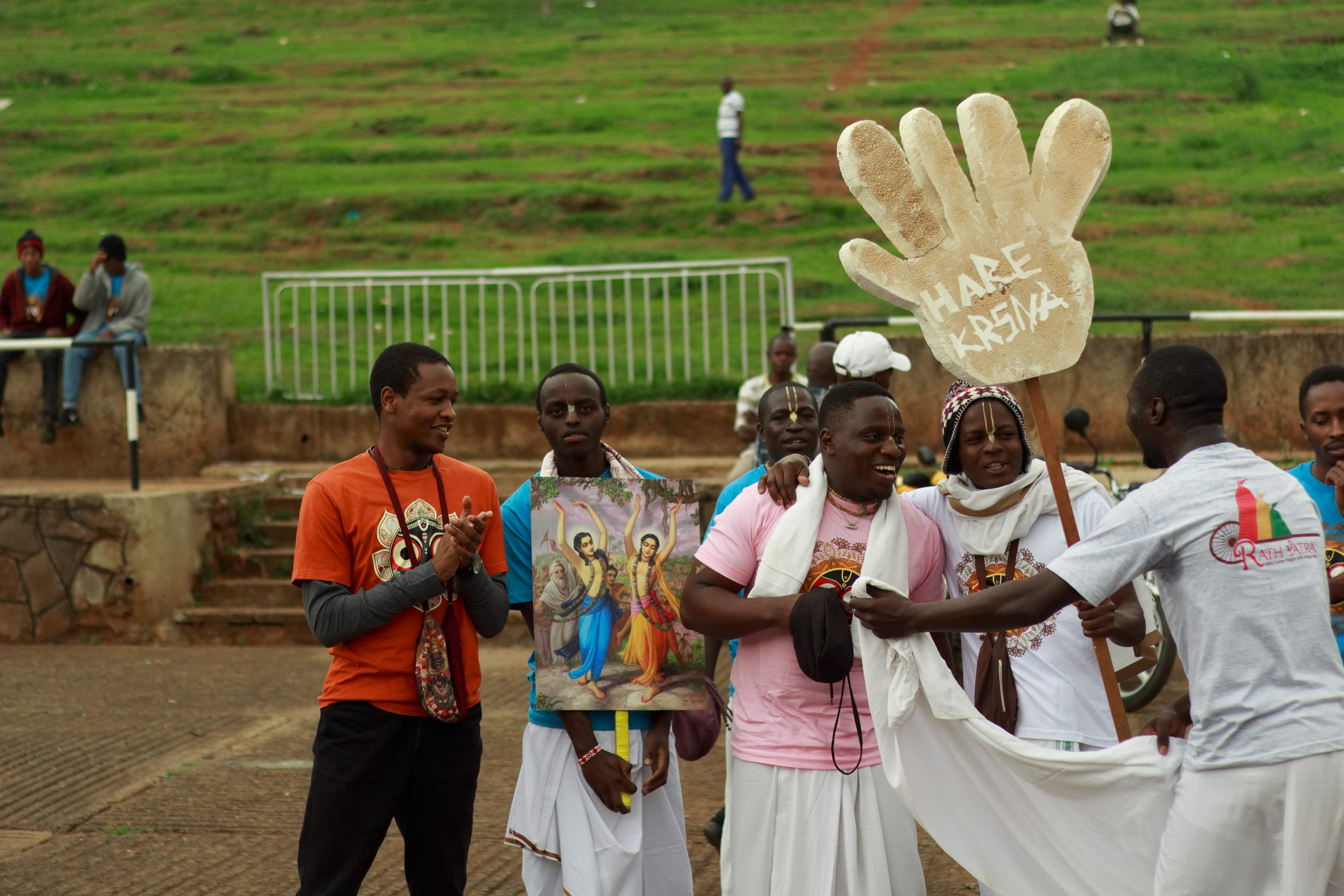 Ratha Yatra devotees in Nairobi carrying a Hare Krishna sign